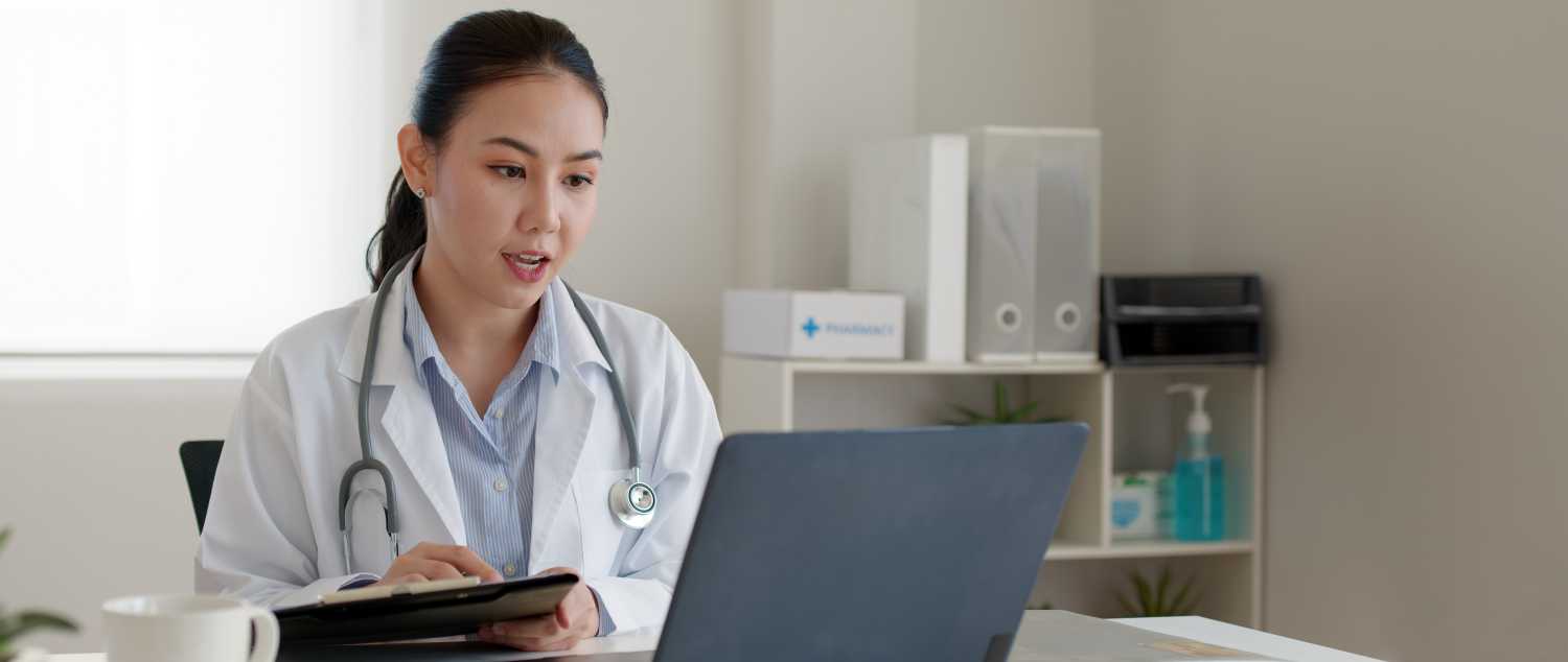 Doctor using computer technology